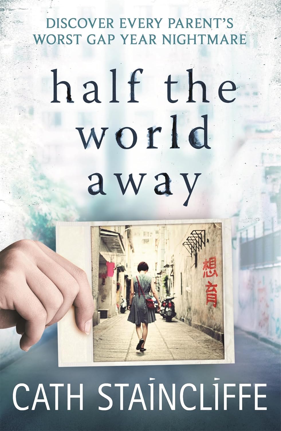 Book cover of 'Half the World Away' by Cath Staincliffe with a hand holding a photo of a person walking down a street.